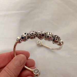 Chamilia charm bracelet with 5 charms.